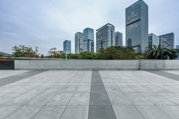 Panoramic skyline and buildings with empty square floor.