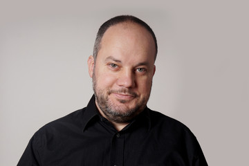 middle aged man in his forties with friendly expression        