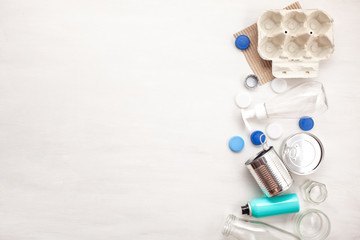 Flat lay of different wastes wastes ready for recycling. Plastic, glass, paper, tin cans