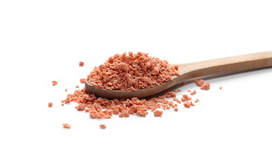 Soy flakes in wooden spoon isolated on white background