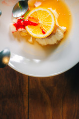 Orange cake on wooden table