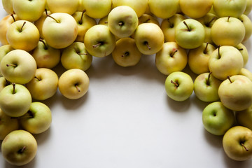Small white apples background with a copy space