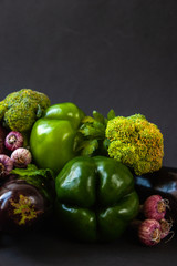 Fresh vegetables on a black background. Food background. Fresh farmer vegetables.