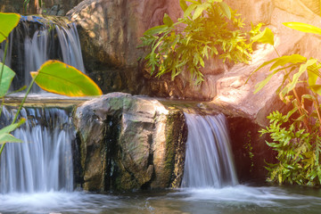 Fototapeta na wymiar Waterfall in garden at the public park