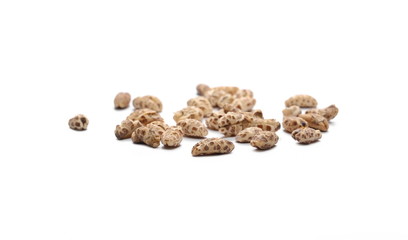 Organic barley flakes, pile isolated on white background