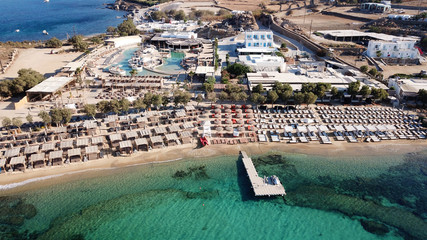 Fototapeta na wymiar Aerial drone bird's eye view from famous beach of Paraga with emerald waters, Mykonos island, Cyclades, Greece