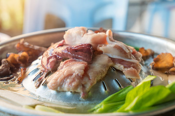Korean barbecue - meat are being cooked on stove