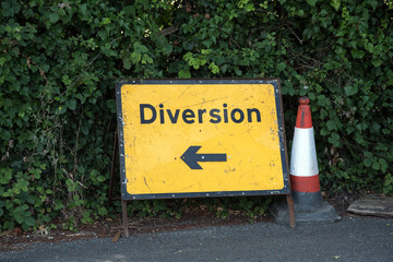 Road diversion sign and cone