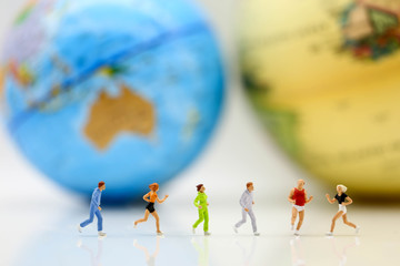 Miniature people : marathon runners with world map, jogging and running,healthy lifestyle and sport concepts.