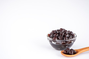  black pearls. Boiled tapioca pearls for bubble tea on white background. Copy space