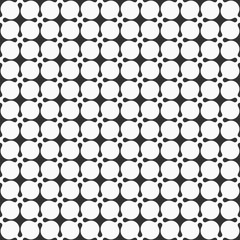 Abstract seamless pattern of symmetric geometric shapes.