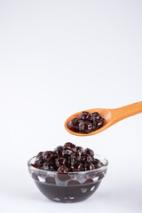  black pearls. Boiled tapioca pearls for bubble tea on white background. Copy space
