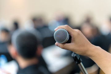 hand hold Microphone in meeting room for a conference