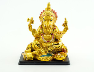 Fototapeta premium Gilded figure of the elephant Ganesha on white background