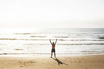 Fototapeta na wymiar Senior caucasian man standing at the beach
