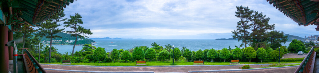 Fototapeta na wymiar Panorama sea view of Admiral Yi Sun Sin memorial park in Geoje island, South Gyeongsang Province, South Korea. View from old Korean style pavilion.