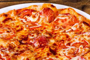 Pepperoni pizza with sausages