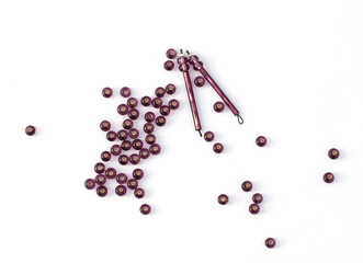 Purple beads isolated on white background. Earrings in preparation.