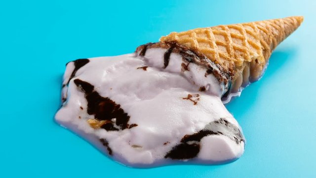 reverse studio shoot sweet potato flavor ice cream melting on blue time lapse