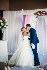 Happy bride and groom on wedding ceremony