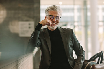 Mature businessman sitting at cafe