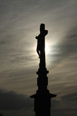 Calvary cross silhouette against grey autumn sky. Czech Republic