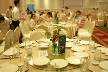 HO CHI MINH CITY, VIET NAM, MARCH, 2018: Original wedding floral decoration in the form of mini-vases and bouquets of flowers put in the table with beautiful mat, green style wedding, a modern wedding