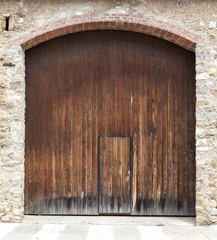 The large ancient wooden door in Spain.