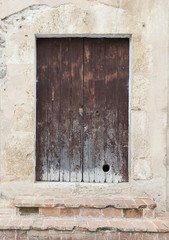 The old big ancient wooden door in Spain.