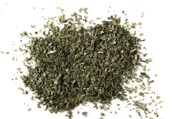 Sliced and cut dry celery leaves pile, isolated on white background, top view