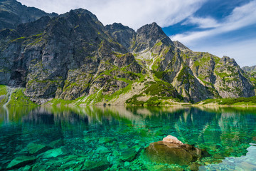Panele Szklane  a delightful scenic mountain landscape and a clean lake  Czarny Staw
