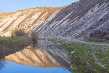 natural scenery with flowing river and hill