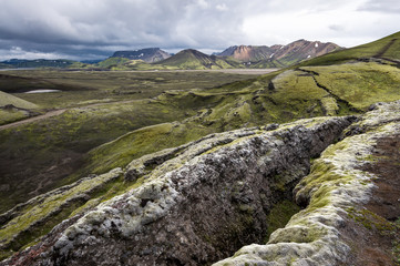 Cracked and wrinkled landscape as a result of geolocial activity in Landmannalaugar (Rainbow Mountains), Iceland