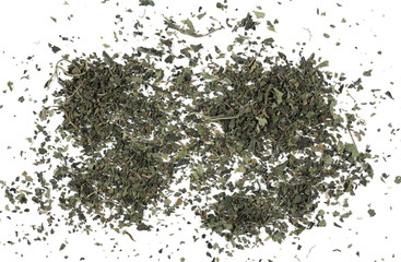 Dry, cut and sliced nettle pile, isolated on white background, top view