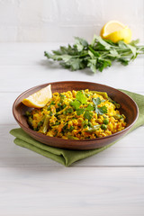 Rice cooked with vegetables, herbs and spice. Vegan cuisine. Healthy vegetarian food concept.