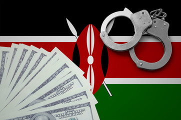 Kenya flag  with handcuffs and a bundle of dollars. The concept of illegal banking operations in US...