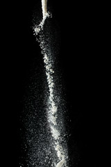flour on a black background