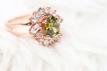 Green gem stone and diamond on pink gold ring