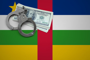 Central African Republic flag  with handcuffs and a bundle of dollars. The concept of breaking the...