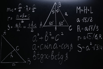 Maths formulas on chalkboard background