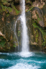 Fototapeta na wymiar Waterfall at the source of the river