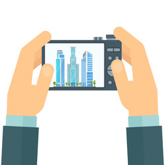 Photographer with a camera in his hands. Snapshot of cityscape. Flat cartoon illustration. Objects isolated on white background.