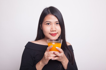 Young Asian woman drink orange juice.