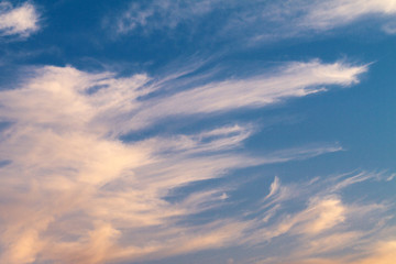 Fototapeta na wymiar beautiful clouds of pink at sunset in the blue sky