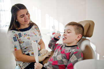 Little boy at dentist chair. Children dental.