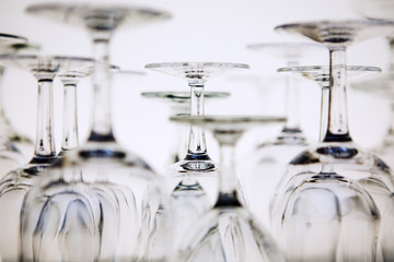 Reversed clean wine glasses on a white background.