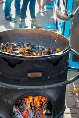 mussels are fried on a brazier