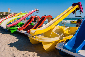 Line of colorful pedalos