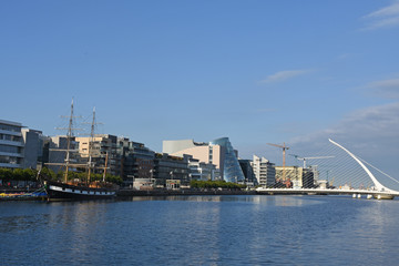 Sailing ship on River Liffey, Samuel Beckett Bridge and CCD in Dublin, Ireland