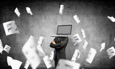 Businessman with laptop instead of head.